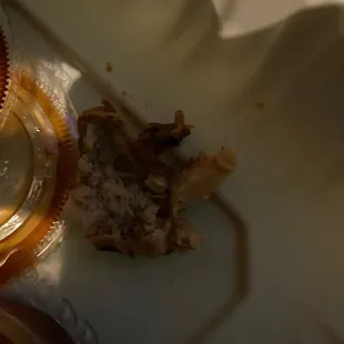 a half eaten cupcake on a plate