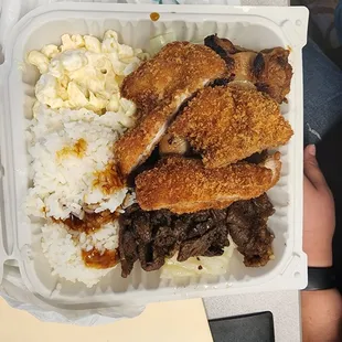 a person holding a container of food