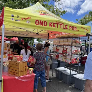 people shopping at an outdoor market