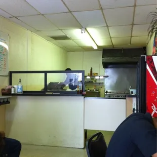 Inside has counters along each wall. Small place but great food.