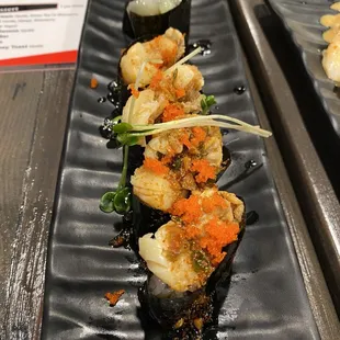 Tako wasabi (back) and scallop nigiri (front)