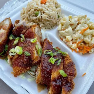 a plate of food with rice and meat