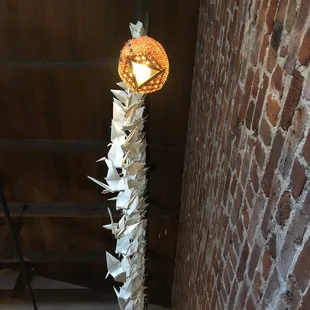 a lamp made out of folded paper