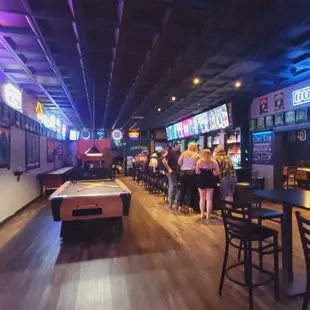 a pool table in the middle of the room