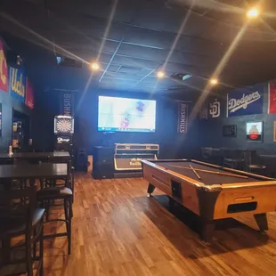 a pool table and a bar