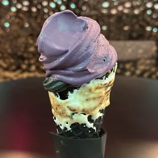 Ube at the top and coconut and the bottom and toasted waffle cone