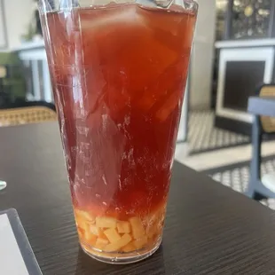 Pomegranate iced tea with mango jelly