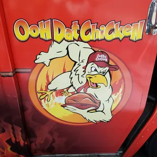 a chicken on the side of a truck