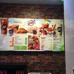 a menu on a brick wall