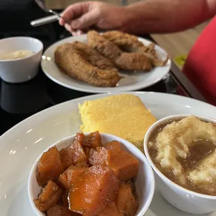 Catfish (4 big pieces, fresh, crispy and tender), candied yams, cornbread (homemade), mashed potatoes w brown gravy