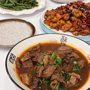 a variety of dishes of food on a table