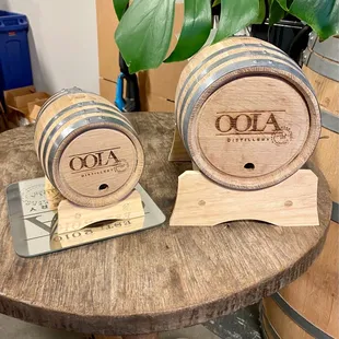 two oak barrels on a table