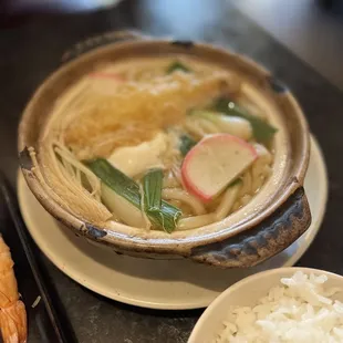 a bowl of soup and a plate of rice