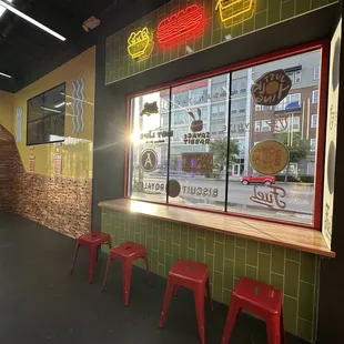 a restaurant with neon signs