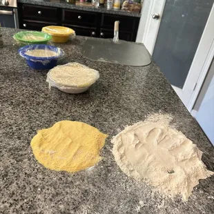 My sons pizza station! Haha we were making hand prints in the flour and cornmeal Lol! He was like ok put yours first momma then me!!
