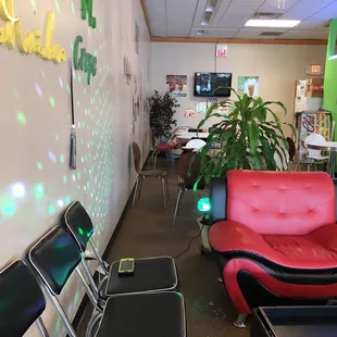 a room with a red chair and a red couch