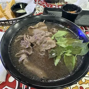 a bowl of beef soup