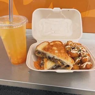 STEAK and CHEESE combo with GARLIC TOTS and a PEACH LEMONADE