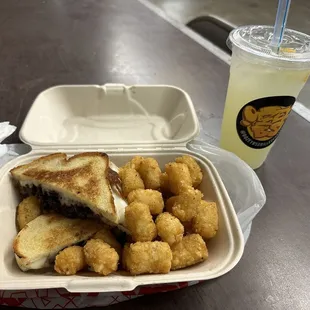 Maple bacon grilled cheese with seasoned tots and a lemonade. One of the best GC Ive ever had!