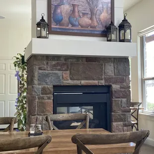 Stone fireplace located in the center of the restaurant.