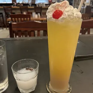 A shot of Ouzo and &quot;Sex in the Greek&quot; cocktail was huge.  The bar is shown in the background.