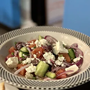 a bowl of greek salad