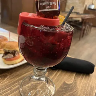 a glass of jelly and a sandwich