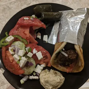 My delivery order-- falafel pita, hummus, Horiatiki salad, and dolmades