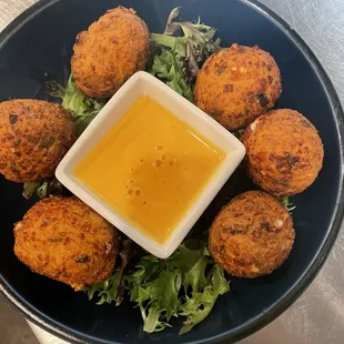 Feta Fritters Housemaid Greek cheese fries served with Sriracha honey mustard