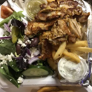 Yeeros platter with chicken, salad, french fries and pita wedges