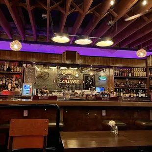 a bar with purple lighting