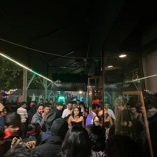 a large group of people standing outside