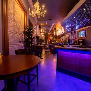a bar with purple lighting