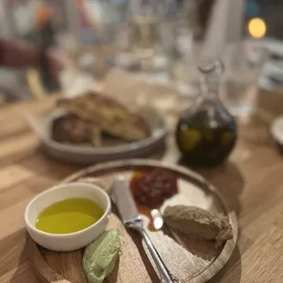 a plate of food with bread and olive oil