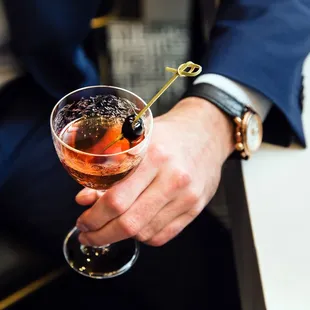 a man holding a glass of wine