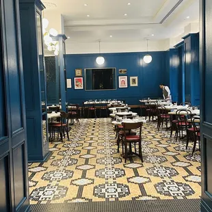 a dining room with tables and chairs