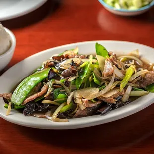 a plate of stir fried vegetables