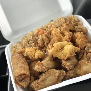a container of fried chicken and rice
