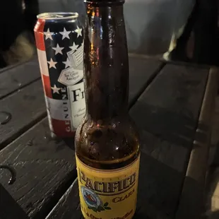 a bottle of beer and a can of beer