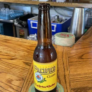 a bottle of beer on a coaster