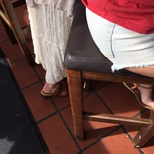 a woman sitting on a bar stool
