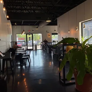 a dining area with tables and chairs