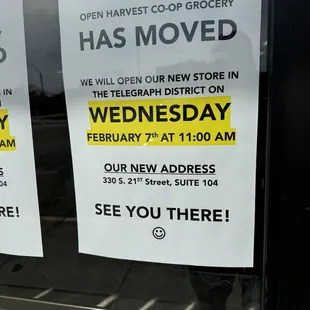 a sign in the window of a grocery store