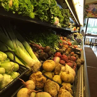 vegetables on display in a grocery store