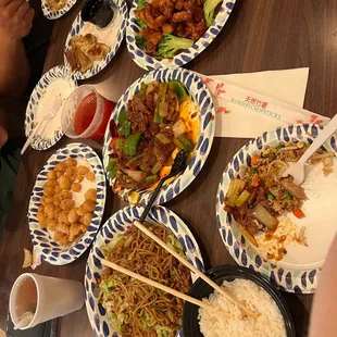 A bunch of food! Chicken chow mein, sweet &amp; sour chicken, orange chicken