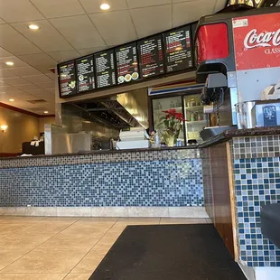 the counter and seating area of a restaurant
