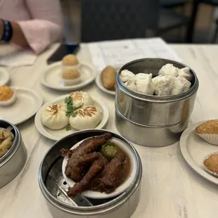 Chicken Feet, beef tripe, fried pork dumplings, fried buns, steamed bbq pork buns, shrimp balls, sesame balls.