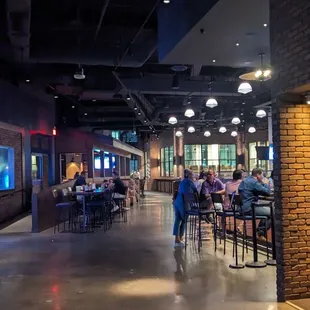 Looking back through the dining area from the bar. Our table of 8 is in view on the right hand side beyond the brick wall n