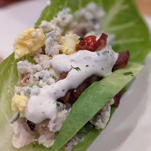 wood-grilled chicken salad, blue cheese, bibb lettuce, avocado, tomato, candied bacon, hard-cooked egg, buttermilk dressing