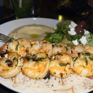 a plate of shrimp and rice